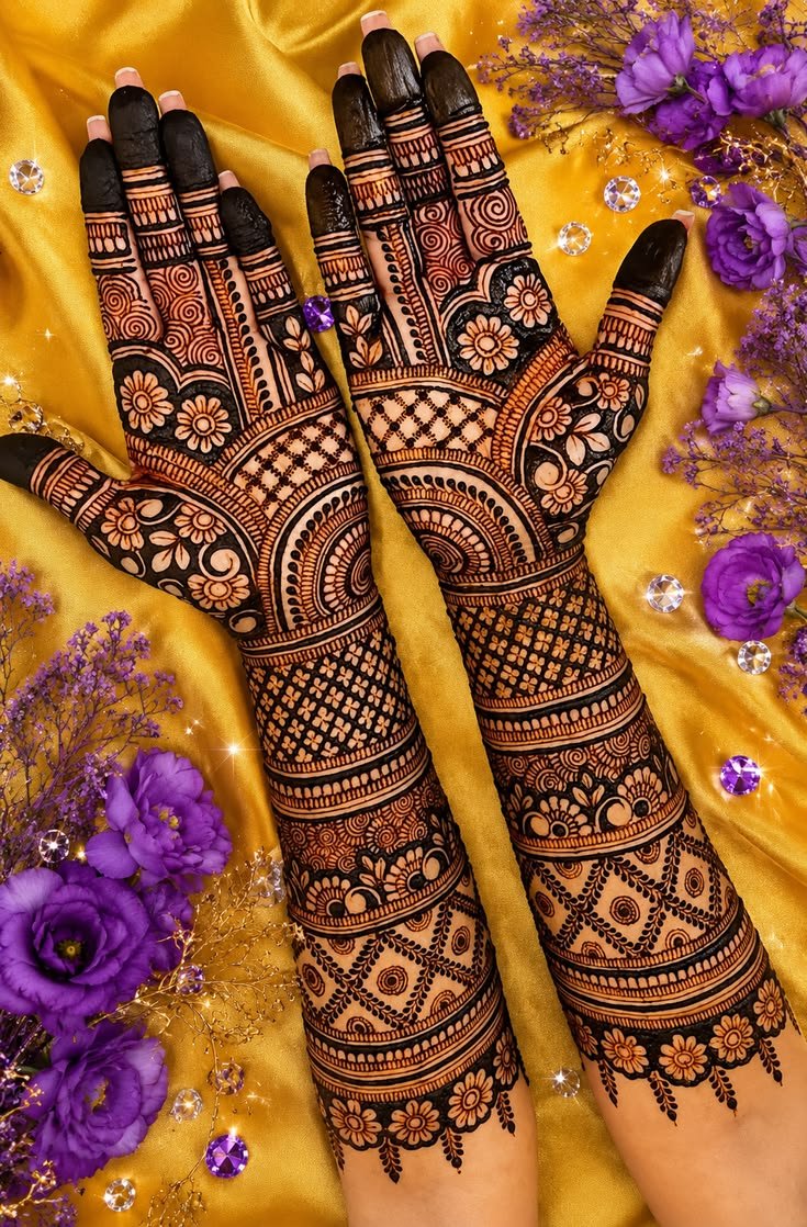 Mehandi invitation card with marigold garlands and illustrated women in lehengas