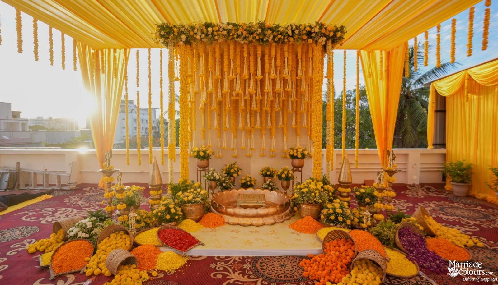 Haldi invitation card with hanging umbrellas and white blossoms